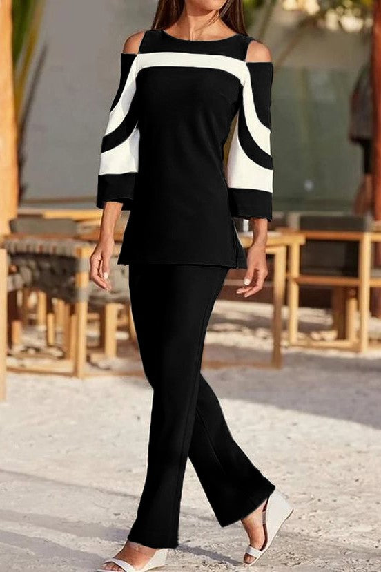 Competo elegante top con maniche a campana e pantaloni, nero