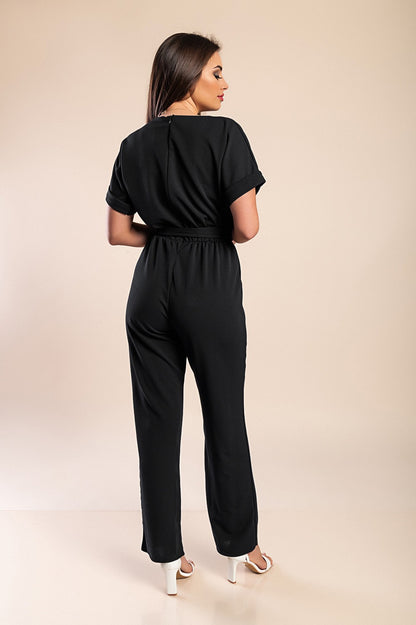 Tuta elegante con dettagli metallici, nera