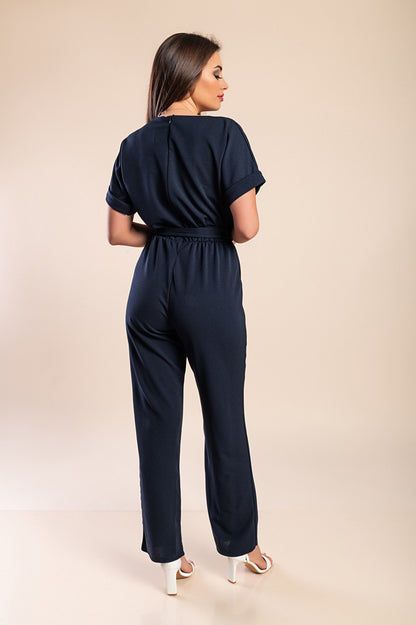 Tuta elegante con dettagli metallici, nera