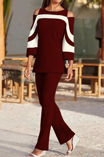 Competo elegante top con maniche a campana e pantaloni, nero