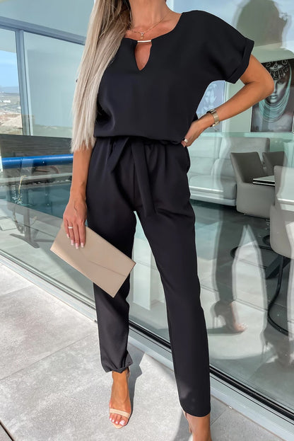 Tuta elegante con dettagli metallici, nera