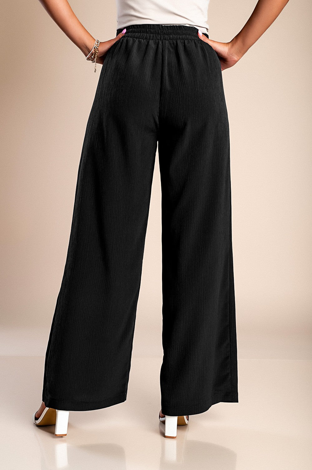 Pantaloni lunghi eleganti con bottoni, neri.